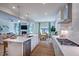 Open kitchen with stainless appliances flows into the dining area and living room, perfect for entertaining at 615 Contento Ct, Sanford, NC 27330