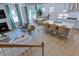 Open-concept living space with modern fireplace, dining area, and a well-lit kitchen at 615 Contento Ct, Sanford, NC 27330