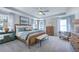 Serene main bedroom with tray ceiling, ceiling fan, lots of natural light, and stylish furnishings at 615 Contento Ct, Sanford, NC 27330