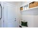 Mudroom with storage, bench and coat hooks, offering a practical and stylish space for organization at 615 Contento Ct, Sanford, NC 27330