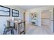 Office with a work desk, shelving, and a view into the hallway featuring wood railing at 615 Contento Ct, Sanford, NC 27330