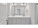 Elegant bathroom featuring double sinks and a large mirror with lighting at 617 Spellbrook Rd, Zebulon, NC 27597