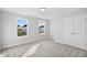 Bright bedroom with two windows and a closet at 617 Spellbrook Rd, Zebulon, NC 27597