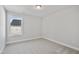 Bedroom with neutral carpet, fresh paint and a window providing natural light at 617 Spellbrook Rd, Zebulon, NC 27597