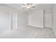 Neutral bedroom showcasing three doors and carpeted floors at 617 Spellbrook Rd, Zebulon, NC 27597