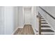 Entryway with stairs, wooden floors, and white door at 617 Spellbrook Rd, Zebulon, NC 27597