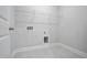 Laundry room with tile floor and wire shelving at 617 Spellbrook Rd, Zebulon, NC 27597