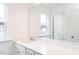 Bathroom featuring a quartz countertop, single sink, and large mirror at 619 Contento Ct, Sanford, NC 27330