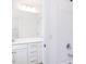 Bright bathroom featuring white cabinets and modern chrome hardware at 619 Contento Ct, Sanford, NC 27330