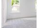 Bedroom features neutral carpet, bright windows, and white walls at 619 Contento Ct, Sanford, NC 27330
