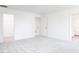 Bright, empty bedroom with neutral carpet, white walls, and access to the bathroom at 619 Contento Ct, Sanford, NC 27330