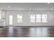 Open-concept living space featuring hardwood floors and bright, natural light at 619 Contento Ct, Sanford, NC 27330