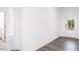 Bright room featuring hardwood floors and a door leading to the backyard at 619 Contento Ct, Sanford, NC 27330