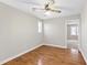 Bright room with hardwood floors, ceiling fan, and a doorway offering natural light and ample space at 6309 Charmco Ct, Wake Forest, NC 27587
