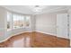 Bright dining room featuring hardwood floors, modern lighting, and a large bay window at 6309 Charmco Ct, Wake Forest, NC 27587