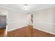 Open dining room with hardwood floors, modern lighting, and easy access to kitchen at 6309 Charmco Ct, Wake Forest, NC 27587