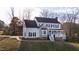 Traditional two-story home boasts a symmetrical facade and a beautifully landscaped front yard at 6309 Charmco Ct, Wake Forest, NC 27587