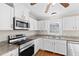 Well-lit kitchen showcasing stainless steel appliances, granite countertops, and plenty of cabinet space at 6309 Charmco Ct, Wake Forest, NC 27587