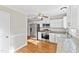 Kitchen featuring stainless steel appliances and countertops with hardwood flooring at 6309 Charmco Ct, Wake Forest, NC 27587