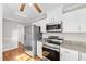 Modern kitchen area with stainless steel appliances and granite countertops at 6309 Charmco Ct, Wake Forest, NC 27587