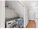 Laundry room with a washer, dryer, and shelving for storage at 6309 Charmco Ct, Wake Forest, NC 27587