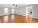Spacious living area with hardwood floors and an abundance of natural light from large windows at 6309 Charmco Ct, Wake Forest, NC 27587