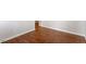 Close up on beautiful hardwood flooring with neutral baseboards and walls at 650 Ganyard Farm Way # 13, Durham, NC 27703