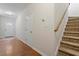 Welcoming foyer featuring hardwood floors, and carpeted stairs at 650 Ganyard Farm Way # 13, Durham, NC 27703