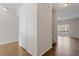 Bright hallway with hardwood floors and neutral wall paint at 650 Ganyard Farm Way # 13, Durham, NC 27703
