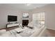 Bright living room features a fireplace, hardwood floors, and sliding glass doors to the outside at 650 Ganyard Farm Way # 13, Durham, NC 27703