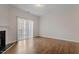 An airy living room has hardwood floors and sliding glass doors at 650 Ganyard Farm Way # 13, Durham, NC 27703