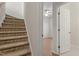 Carpeted staircase leads upstairs, with a view to a bedroom at 650 Ganyard Farm Way # 13, Durham, NC 27703