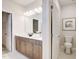 Bright bathroom featuring double sinks, walk in closet and a separate toilet at 68 Victory View Ter, Smithfield, NC 27577