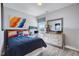 Bedroom with a blue comforter, a desk, and NASA themed accessories at 68 Victory View Ter, Smithfield, NC 27577