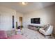 Relaxing bonus room featuring TV, seating, and neutral decor at 68 Victory View Ter, Smithfield, NC 27577