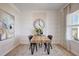 Elegant dining area with modern light fixture and wall decor at 68 Victory View Ter, Smithfield, NC 27577