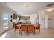 Bright dining area showcasing a wooden table with orange chairs and modern décor at 68 Victory View Ter, Smithfield, NC 27577