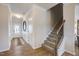 Bright entryway with decorative mirror and staircase to the upper floors at 68 Victory View Ter, Smithfield, NC 27577