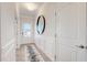 Bright entryway with decorative mirror and stylish rug at 68 Victory View Ter, Smithfield, NC 27577