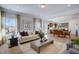 Inviting living area combines modern living and dining spaces with chic décor and natural light at 68 Victory View Ter, Smithfield, NC 27577