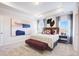 Spacious main bedroom with tray ceiling, bench, and stylish decor at 68 Victory View Ter, Smithfield, NC 27577