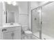 Pristine bathroom with glass-enclosed shower, white vanity, and modern fixtures for a clean and refreshed feel at 741 Aristocrat Ln, Knightdale, NC 27545