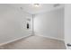 This cozy bedroom has neutral carpet, base trim, a window, and neutral paint to create a calming space at 741 Aristocrat Ln, Knightdale, NC 27545