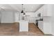 Modern kitchen boasts white cabinetry, stainless steel appliances, and an open layout perfect for entertaining at 741 Aristocrat Ln, Knightdale, NC 27545