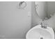 Powder room with modern sink, chrome fixtures and round mirror at 84 Ripple Way # 313, Clayton, NC 27520