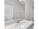Bathroom featuring a modern vanity, sleek mirror, and a shower-tub combo with tile surround at 84 Ripple Way # 313, Clayton, NC 27520