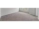 Empty bedroom with plush carpet, neutral paint and window with neighborhood view at 84 Ripple Way # 313, Clayton, NC 27520