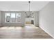Dining area with natural light and hardwood floors, sliding glass door leading to patio at 84 Ripple Way # 313, Clayton, NC 27520