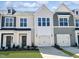 Charming new townhomes with Hardie siding, Craftsman-style doors and one car garages offer a touch of modern living at 84 Ripple Way # 313, Clayton, NC 27520