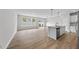 Kitchen island with hardwood floors and stainless steel dishwasher in open floor plan at 84 Ripple Way # 313, Clayton, NC 27520
